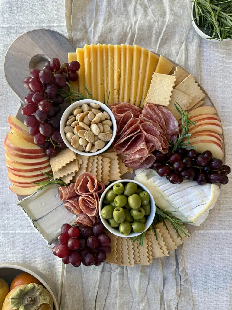 Whole foods charcuterie board step 6 rosemary garnish