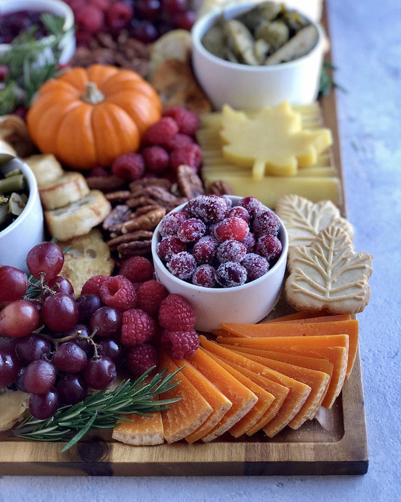 sugared cranberries on a cheese plate